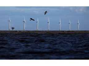 Birds fly past offshore wind turbines off the coast in Clacton On Sea, U.K., on Tuesday, Oct. 6, 2020. U.K. Prime Minister Boris Johnson committed to boosting U.K. offshore wind power as part of his delayed plan for a "green industrial revolution" as he seeks to get his stalled domestic agenda back on course.