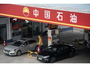 Vehicles refuel at a PetroChina Co. gas station in Shanghai, China, on Thursday, Jan. 7, 2021. China's energy markets are tightening as the economy rebounds and freezing weather grips much of the northern hemisphere, a dynamic that's likely to be exacerbated by reduced Saudi oil output. Photographer: Qilai Shen/Bloomberg