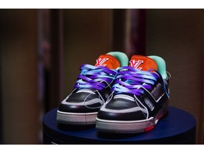 A pair of upcycled luxury trainers on display on the LVMH Moet Hennessy Louis Vuitton SE sustainable fashion exhibition area at the Viva Technology conference at Porte de Versailles exhibition center in Paris, France, on Wednesday, June 16, 2021. Viva Tech runs June 16 - 19.