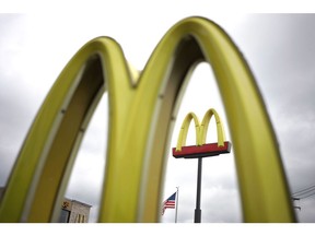 Signage is displayed at a McDonald's Corp. fast food restaurant in Louisville, Kentucky, U.S., on Friday, Oct. 22, 2021. Photographer: Luke Sharrett/Bloomberg