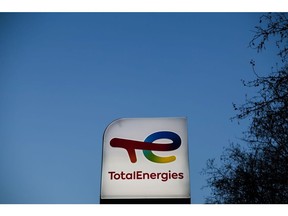 Signage for TotalEnergies SE at a gas station in Toulouse, France, on Thursday, Feb. 10, 2022. TotalEnergies promised to increase its dividend and buy back more shares after posting a record fourth-quarter profit. Photographer: Matthieu Rondel/Bloomberg
