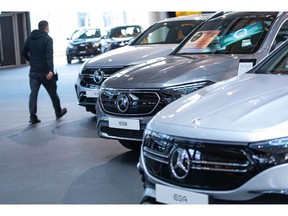 Mercedes-Benz electric vehicles inside a Mercedes-Benz AG showroom in Berlin, Germany, on Tuesday, Feb. 24, 2022. Mercedes-Benz expects profitability at its main cars division to slip this year as the German manufacturer sees more drag from supply-chain snarls and a surge in raw-material costs. Photographer: Krisztian Bocsi/Bloomberg