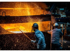 KREFELD, GERMANY - APRIL 21: Workers prepare to pour ductile iron casting molten iron into a mould at the Siempelkamp Giesserei foundry on April 21, 2022 in Krefeld, Germany. The Siempelkamp foundry is one of many companies in Germany's manufacturing sector that would be acutely affected by a halt of Russian energy imports, especially natural gas. The company, which makes parts including for applications in the renewable energies sector, is one of the few in Europe that can cast pieces up to 300 tons. A company spokesman said that a disruption to Germany's natural gas supply would bring much of the foundry's manufacturing ability to a halt. In addition Siempelkamp is already facing multifold price increases for its raw materials, including scrap iron, nickel, aluminum and other metals, due to the current EU sanctions against Russia. The German government is currently wrestling with how it can reduce Germany's heavy dependence on Russian energy imports in the wake of Russia's military invasion of Ukraine.