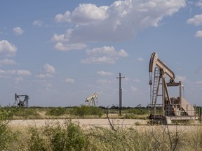 Pump jacks extract oil n Andrews County, Texas, US, on Wednesday, Sept. 29, 2021. America's oil communities have deep financial ties to the fossil fuel industry. Now even in the midst of a price boom, local governments have to start deciding when to tackle plans for the looming clean energy transition. Photographer: Matthew Busch/Bloomberg