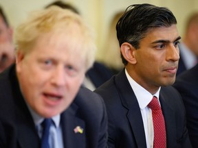 LONDON, ENGLAND - JUNE 07: Britain's Chancellor Rishi Sunak (C) listens as Prime Minister Boris Johnson (L) addresses his Cabinet ahead of the weekly Cabinet meeting in Downing Street on June 07, 2022 in London, England. The Prime Minister survived a confidence vote last night but potentially has long-term problems ahead as he faces rebellion within his party.