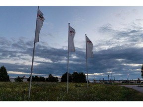 Flags outside the TotalEnergies SE Leuna oil refinery in Leuna, Germany, on Tuesday, June 7, 2022. TotalEnergies' 240,000 barrels per day Leuna refinery is set to cease importing Russian crude oil via the Druzhba pipeline some time later this year. Photographer: Krisztian Bocsi/Bloomberg