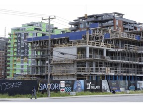A condo building under construction in Lasalle, Quebec, Canada, on Thursday, June 2, 2022. Bank of Canada Governor Tiff Macklem said rising interest rates aren't expected to derail the nation's economy and may even produce a "healthy" slowdown in the housing market.