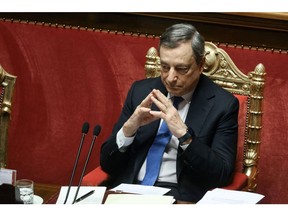 Mario Draghi, Italy's prime minister, listens during a debate at the Senate in Rome, Italy, on Tuesday, June 21, 2022. Italy's biggest party is set to splinter over the country's support for Ukraine, just as Draghi defended in parliament his government's stance on the conflict.
