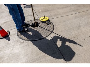 A fuel distributor checks the level of a gas storage tank at a Safeway gas station in Hercules, California, U.S., on Wednesday, June 22, 2022. President Joe Biden called on Congress to suspend the federal gasoline tax, a largely symbolic move by an embattled president running out of options to ease pump prices weighing on his party's political prospects. Photographer: David Paul Morris/Bloomberg