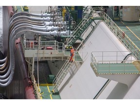 A worker on the UMM BAB liquefied natural gas (LNG) tanker during the ship to ship operation at Fauji Oil Terminal & Distribution Co. Ltd. in Karachi, Pakistan, on Friday, June 24, 2022. This is the third time this month that Pakistan failed to complete an liquefied natural gas (LNG) tender for July, and the country's inability to purchase fuel threatens to exacerbate electricity shortages just as hotter weather boosts air conditioning and power demand.