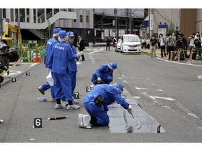 Police officers at the scene where Former Japanese Prime Minister Shinzo Abe was shot during a political event in Nara, Japan, on Friday, July 8, 2022. Abe was unresponsive after being shot during a political event on Friday, shocking a nation where gun violence is rare.