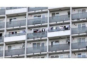 Washing hangs on balconys in Hackney in London on July 17, 2022.