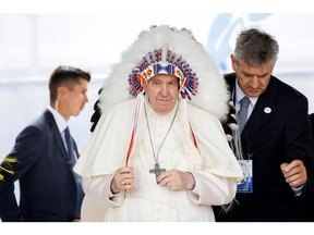 MASKWACIS, AB - JULY 25: Pope Francis wears a traditional headdress that was gifted to him by indigenous leaders following his apology during his visit on July 25, 2022 in Maskwacis, Canada. The Pope is touring Canada, meeting with Indigenous communities and community leaders in an effort to reconcile the harmful legacy of the church's role in Canada's residential schools.