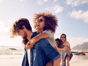 Young friends enjoying a day at beach.