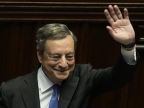 Italian Premier Mario Draghi waves to lawmakers at the end of his address at the Parliament in Rome, Thursday, July 21, 2022. Premier Mario Draghi's national unity government headed for collapse Thursday after key coalition allies boycotted a confidence vote, signaling the likelihood of early elections and a renewed period of uncertainty for Italy and Europe at a critical time.