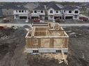 Canada Mortgage and Housing Corporation says the annual pace of housing starts in June slowed compared with May. 
