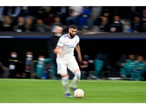 Real Madrid's French forward Karim Benzema runs with the ball during a UEFA Champions League match Photographer: Gabriel Bouys/AFP/Getty Images