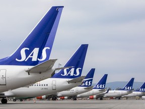 FILE - SAS planes are grounded at Oslo Gardermoen airport during pilots strikes, in Oslo, Friday, April 26, 2019. SAS has filed for bankruptcy in the United States, warning the announcement of a strike by 1,000 pilots a day earlier had put the future of the carrier at risk which added to the travel chaos across Europe as the summer vacation period begins. The group said Tuesday, July 5, 2022 it had "voluntarily filed for chapter 11 in the U.S.," and said its operations and flight schedule will be unaffected.