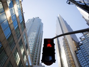 A crosswalk sign flashes red in the financial district of Toronto.