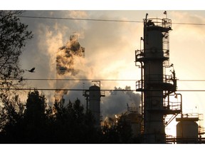 An Exxon Mobil refinery in silhouetted against the sky at dusk in Torrance, California, U.S.