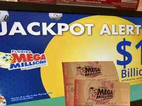 Mega Millions lottery tickets are shown, Wednesday, July 27, 2022, at a lottery retailer in Surfside, Fla. A giant Mega Millions lottery jackpot ballooned to $1.02 billion after no one matched all six numbers and won the top prize.