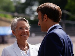 Elisabeth Borne and Emmanuel Macron. Photographer: Gonzalo Fuentes/AFP/Getty Images