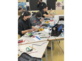 Indigenous youth from Unama'ki P-TECH participating in a STEM program delivered by Ulnooweg Education Centre in Eskasoni First Nation on May 28, 2022. The program is a partnership between the Mi'kmaw Economic Benefits Office, Mi'kmaw Kina'matnewey, the Nova Scotia Community College and IBM.