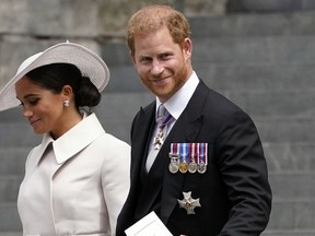 FILE - Prince Harry and his wife Meghan, Duchess of Sussex, depart after attending a service of thanksgiving for the reign of Queen Elizabeth II at St Paul's Cathedral in London, June 3, 2022. Prince Harry won the first stage of a libel suit against the publisher of Britain's Mail on Sunday newspaper as a judge ruled Friday, July 8 that parts of a story about his fight for police protection in the U.K. were defamatory.