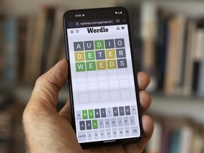 A Wordle game is seen on a mobile phone, Friday, July 15, 2022, in Boston. Hasbro Inc. and The New York Times, which owns Wordle, announced Thursday that Wordle: The Party Game will be available for purchase in North America in October.