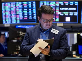 A trader works on the floor of the New York Stock Exchange.