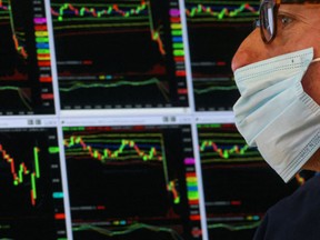 A specialist trader works on the floor of the New York Stock Exchange.