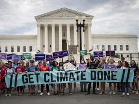 Environmental activists rally in front of the U.S. Supreme Court on July 6, 2022 in Washington, DC.