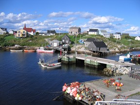Houses dot the rocky shores of Peggy's Cove, Nova Scotia.
