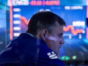 A trader works on the floor of the New York Stock Exchange.