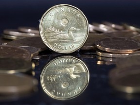 The Canadian dollar coin, the Loonie, is displayed Friday, January 30, 2015 in Montreal.