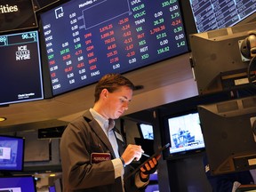 Traders work on the floor of the New York Stock Exchange.