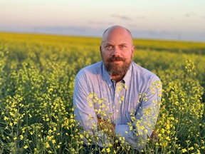 Eric Giesbrecht, a chef and owner of Brassica Mustard, in a mustard field in Langdon, Alta.