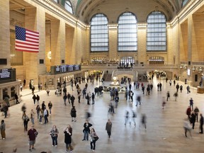 FILE - Commuters pass through Grand Central Terminal on March 10, 2020 in New York. Millennials are known for changing jobs often, but how does that affect their retirement savings? That depends on several factors. It's a good idea to weigh the pros and cons before taking the leap.