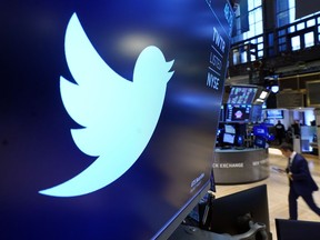 FILE - The logo for Twitter appears above a trading post on the floor of the New York Stock Exchange, Nov. 29, 2021. Twitter claims in a lawsuit filed Tuesday, July 12, 2022, in Delaware, that Musk's "outlandish" and "bad faith" actions have caused the social media platform irreparable harm and sank its stock price.