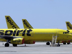 FLE - A line of Spirit Airlines jets sit on the tarmac at the Orlando International Airport on May 20, 2020, in Orlando, Fla. JetBlue is buying Spirit Airlines, Thursday, July 28, 2022, in a $3.8 billion deal, a day after Spirit and Frontier Airlines agreed to abandon their merger proposal.