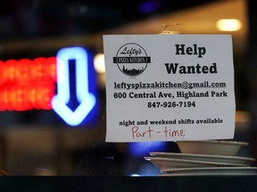 Hiring sign is displayed at a restaurant in Highland Park, Ill., Thursday, July 14, 2022. The number of Americans applying for unemployment benefits last week rose to its highest level in more than eight months, a sign the labor market may be showing some weakness. Applications for jobless aid for the week ending July 16 rose by 7,000 to 251,000, up from the previous week's 244,000, the Labor Department reported Thursday, July 21.