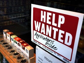 FILE - A help-wanted sign hangs in the front window of the Bar Harbor Tea Room, Saturday, June 11, 2022, in Bar Harbor, Maine. America's employers shrugged off high inflation and weakening growth to add 372,000 jobs in June, a surprisingly strong gain that will likely spur the Federal Reserve to keep sharply raising interest rates to try to cool the economy and slow price increases. The unemployment rate remained at 3.6% for a fourth straight month, the government said Friday, July 8.