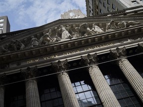 FILE - Sunlight shines on the facade of the New York Stock Exchange, Friday, July 8, 2022, in New York. U.S. futures and most global benchmarks fell Tuesday, Jly 12, 2022, with new data dropping this week on inflation, as well as the start of the earnings season.