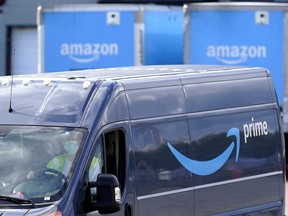 FILE - In this Oct. 1, 2020 file photo, an Amazon Prime logo appears on the side of a delivery van as it departs an Amazon Warehouse location in Dedham, Mass. Amazon is raising its Prime fees in Europe, the company told customers on Tuesday, July 26, 2022 days ahead of its second quarter earnings report.
