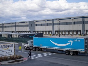 FILE - A truck arrives at the Amazon warehouse facility on the Staten Island borough of New York, April 1, 2022. Amazon is barring off-duty warehouse workers from the company's facilities, a move organizers say can hamper union drives.