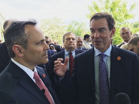 FILE - Braidy Industries Inc. CEO Craig Bouchard, right, and then-Republican Kentucky Gov. Matt Bevin speak with reporters in Wurtland, Ky., on April 26, 2017. Braidy Industries still needs to raise $500 million to build a long-promised $1.7 billion aluminum plant in Appalachia, a top company executive told Kentucky lawmakers on Tuesday, July 19, 2022.