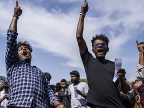 Protesters shout slogans demanding acting president and prime minister Ranil Wickremesinghe resign in Colombo, Sri Lanka, in Colombo, Sri Lanka, Tuesday, July 19, 2022.