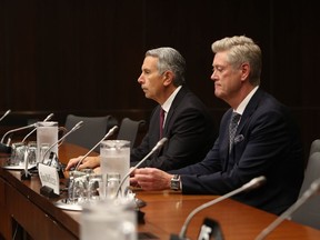 Tony Staffieri, president and chief executive officer of Rogers Communications Inc., left, and Ron McKenzie, chief technology and information officer of Rogers Communications Inc., testify during a Standing Committee on Technology and Industry hearing in Ottawa on Monday.