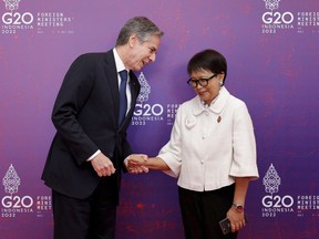 U.S. Secretary of State Antony Blinken, left, meets Indonesia's Foreign Minister Retno Marsudi at the G20 Foreign Ministers' Meeting in Nusa Dua, Bali, Indonesia Friday, July 8, 2022.