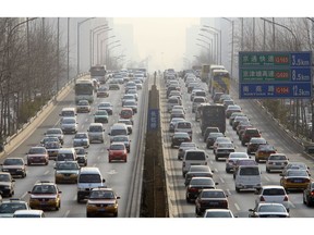 Cars work their way through traffic inside the Third Ring Road in Beijing, China, on Wednesday, Jan. 9, 2008. China is expected to announce annual car sales figures on Jan. 10. Photographer: DOUG KANTER/BLOOMBERG NEWS